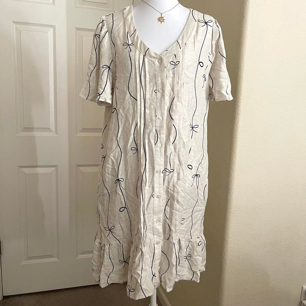 NWT creamy white button down dress with black bow and swirl design